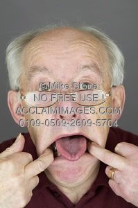 Photo of an Elderly Man Pulling a Funny Face