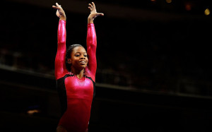 Gabby Douglas reacts after competing on the beam during day two of the ...