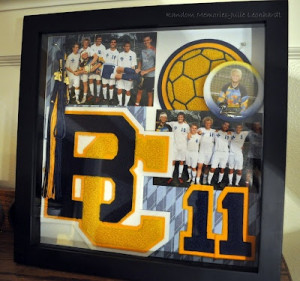 ... Shadow box displaying varsity letters and sports memorabilia