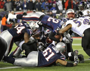 New England Patriots quarterback Tom Brady (above left) leaps to score ...