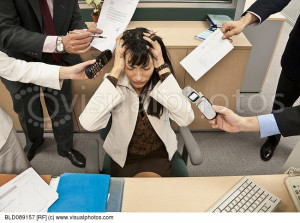 Business people bothering stressed businesswoman