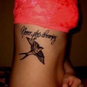 24. Solid Black Swallow with Quote Side Tattoo