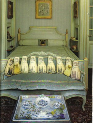 The Duchess of Windsor's bedroom with its display of pug cushions.