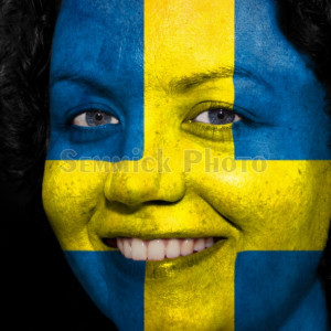 woman with swedish flag painted on her face to show sweden support in