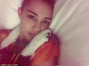 ... her pooch on Saturday after rumours of her kissing Benji Madden at a