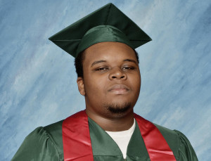 Image: Michael Brown poses for a photo in his cap and gown taken in ...