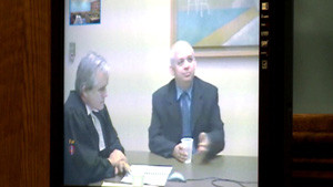 Mark White right appeared by videoconference from Corner Brook