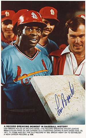 Lou Brock setting the all-time record in stolen bases.