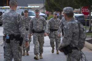 Troops leave Ferguson as protests turn calmer