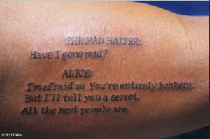 Who gets a tattoo of a conversation from Alice in Wonderland? This guy ...
