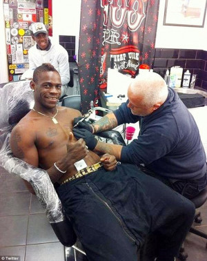 Tat's amazing: Manchester City striker Mario Balotelli gets his ...