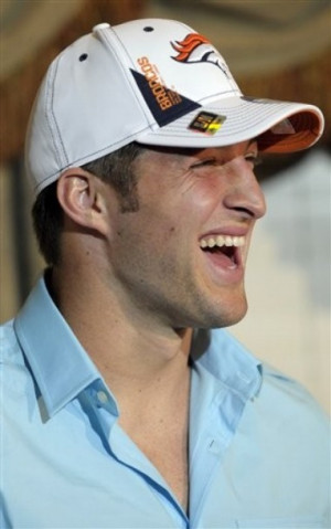 Denver Broncos first-round draft pick Tim Tebow laughs while answering ...