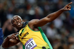 Photo: Who else? Jamaica's Usain Bolt strikes his trademark pose after ...
