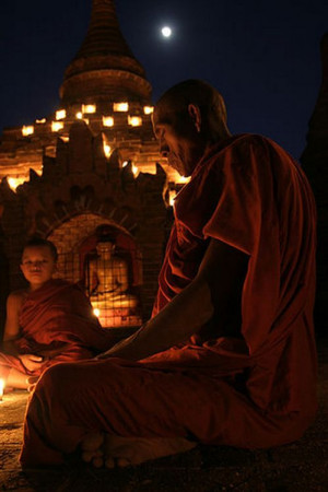 Bagan, Burma - monks, candles, and full moon.