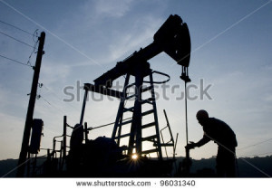 . 31: A roughneck maintains a nodding donkey at a producing oil field ...