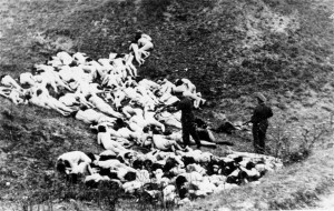 Nazis shooting Jews at the edge of a pit