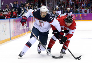 James van Riemsdyk #21 of the United States challenges Duncan Keith #2 ...