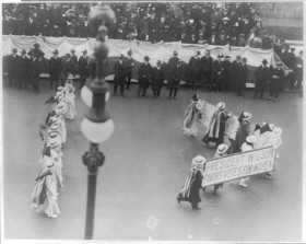 parade in New York City in 1916 with a banner that reads 