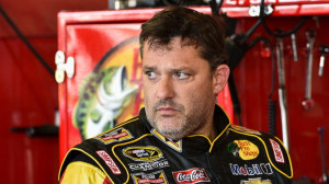 Tony Stewart stands in the garage area after a practice session for ...