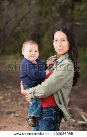 Native American mother and her mixed race baby boy enjoying a day in ...
