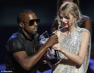 ... MTV stage and grabs microphone during Taylor Swift's acceptance speech