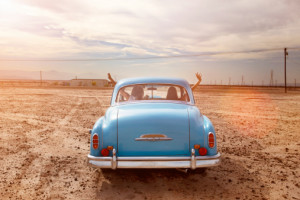Two Girls Driving Blue Vintage Car In The Desert Stock Photo 456255389 ...
