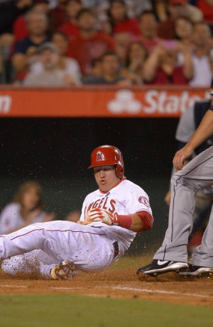 Los Angeles Angels' Mike Trout, left, scores on a wild pitch as ...