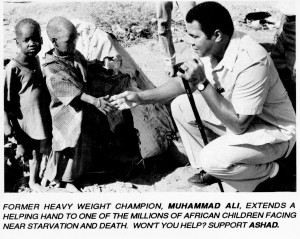 Photograph of two unidentified African Children and Muhammad Ali