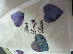 Machine embroidered tea towels with wine sayings and appliqué hearts