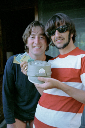 John Lennon and Ringo Starr (with his Monopoly winnings - paper money ...