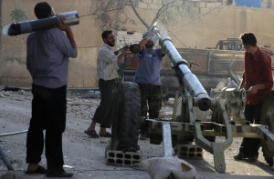 Free Syrian Army fighters prepare a mortar after what activists said ...