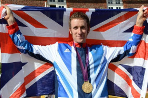 Bradley Wiggins with the Union Jack and Olympic medal