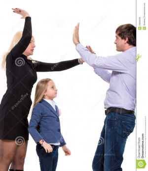Sad looking girl with her fighting parents on a white background.