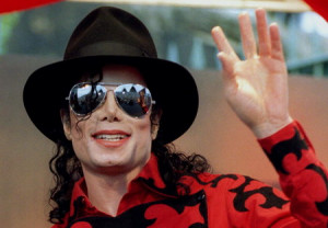Michael Jackson waves to the crowd, numbering a few thousand, gathered ...