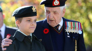 chats with Army Cadet Tristen Garnhum, 12, after the Remembrance Day ...