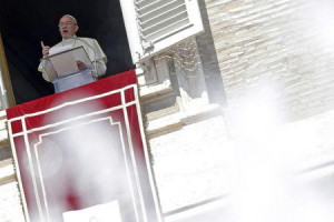 Pope Francis talks from the window during his Sunday Angelus prayer in ...