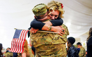 Touching moment: Michelle Cain grabs onto her husband Cpl. Lee Cain as ...
