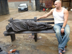 Canadian sculptor Timothy P. Schmalz with a 'Homeless Jesus' statue.