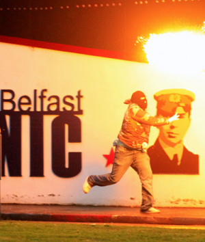 Loyalist rioters throw petrol bombs towards the mainly Catholic Short ...
