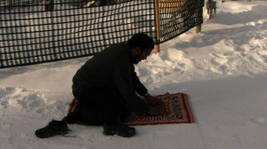 One brother praying on the snow