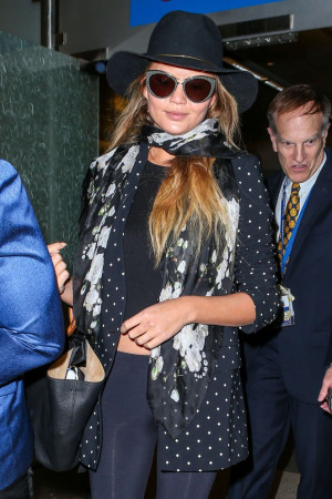 Chrissy Teigen Arrives at LAX airport in LA