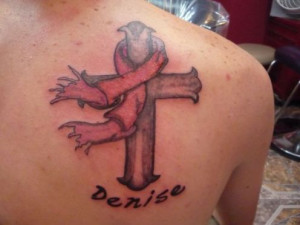 Personalized Cross Tattoo for cancer awareness on a woman's back