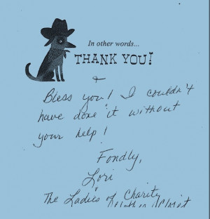 Students George Reichert and JC James stack shelves with food.