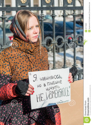 , RUSSIA - 8 MARCH: Russian activist holds placard quotes Russian ...