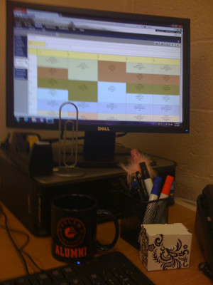 My desk is long and my computer is in the corner and the rest of the ...