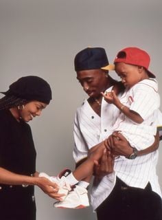 2Pac, and child extra share a moment during a break in filming Poetic ...