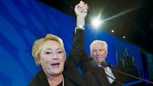 Bloc Quebecois leader Gilles Duceppe takes the hand of Parti Quebecois ...