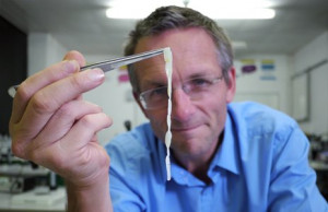 Michael Mosley holds up a human tapeworm