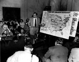 Sen. Joseph McCarthy, (R-Wis.) points to a map headed 