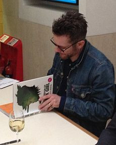 Jamie Hewlett in 2014 signing copies of 